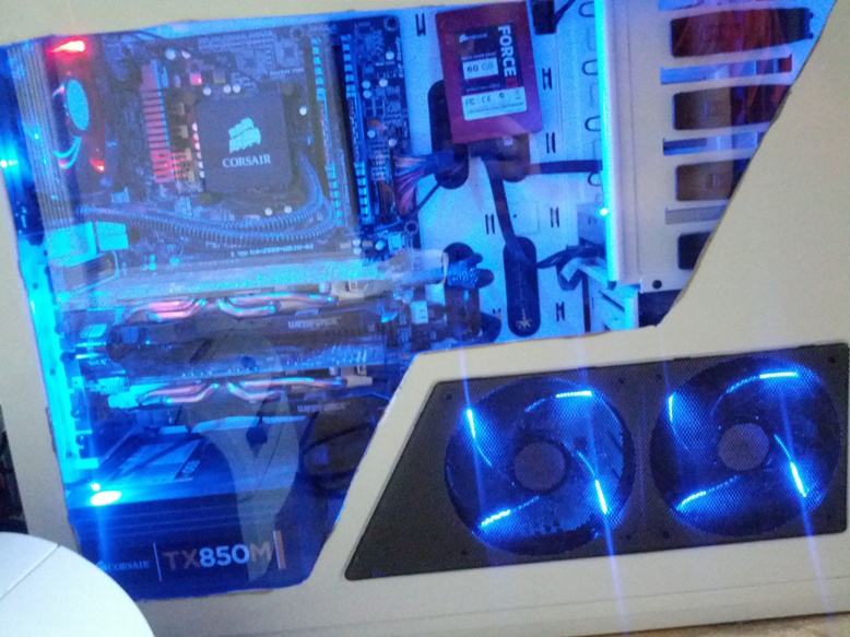Blue-lit gaming rig with dual case fans glowing