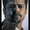 Intense film still — a face behind the gun