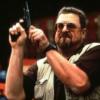 Movie still: The Big Lebowski's Walter with a gun