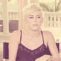 Blonde pixie-cut woman staring blankly, faded vintage filter