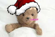 Sick teddy bear in a Santa hat, thermometer in mouth