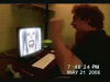 Grainy webcam shot of a PS3 tutorial video