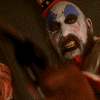 Captain Spaulding grins from the shadows of horror lore