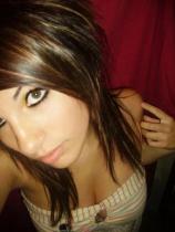 Classic 2010s selfie with smokey eyeliner and scene hair