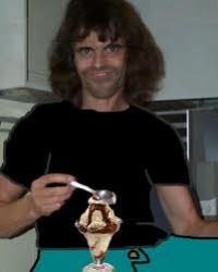 Guy with epic hair enjoying a sundae, classic forum meme