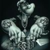 Tatted-up gangster grandpa grinding chips at the poker table