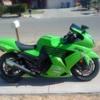 Green sportbike parked curbside, a random ride pic