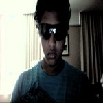 Webcam selfie with sunglasses, classic forum avatar vibe