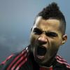 Soccer player mid-celebration, cheering with fists clenched