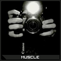 Grainy camera-in-hand avatar with 'MUSCLE' tag