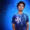 Blue galaxy-style avatar with cross graphic tee
