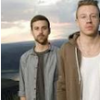 Two guys against a cloudy sky backdrop