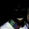 Grinning face lit in the darkness, forum avatar vibes