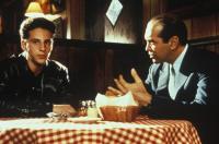 Two guys having a tense diner conversation