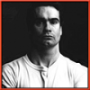 Moody black-and-white member avatar with red border