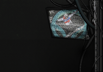 Grainy shark GFX signature tucked among tangled cables