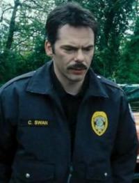 Mysterious officer Swan, standing guard in the woods