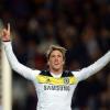 Footballer celebrating a goal, arms raised