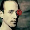 Moody portrait avatar with a red rose overlay