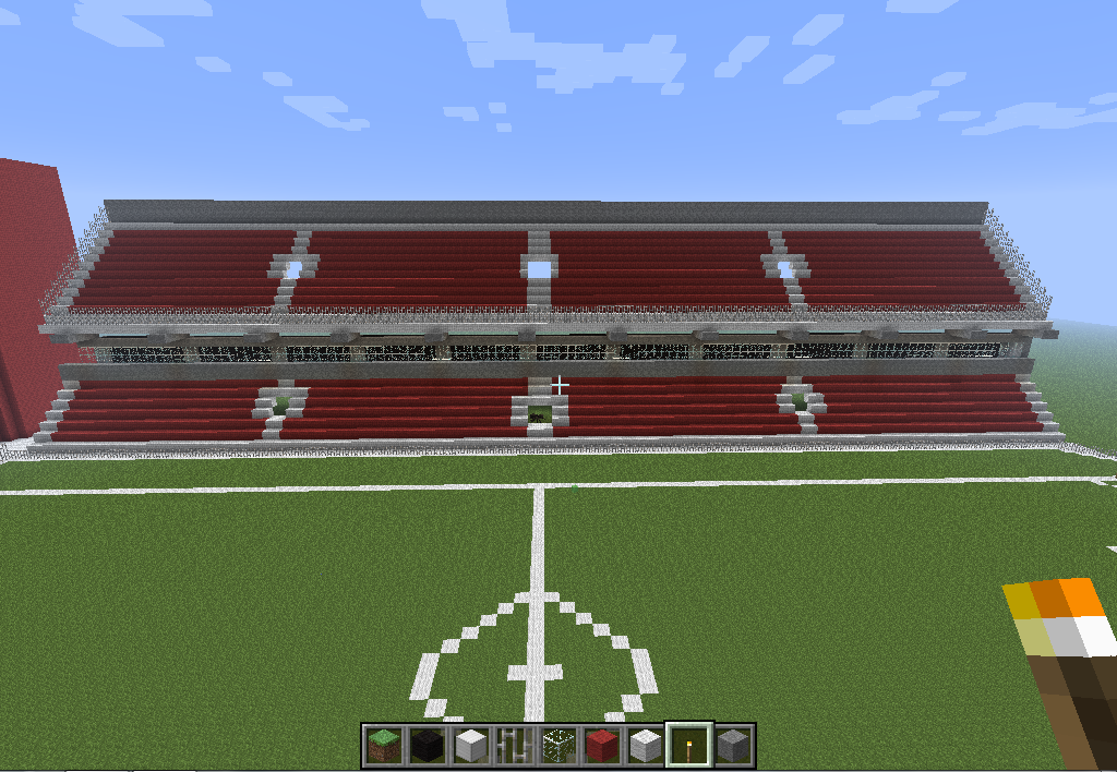 Minecraft stadium build with red seating stands