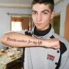 Forum member showing off a tattoo in a candid photo
