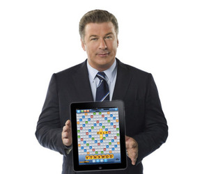 Alec Baldwin holds up his Words With Friends game