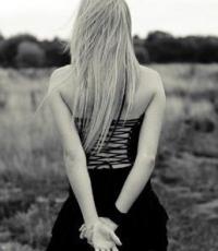 Grainy black-and-white shot of a girl in a field
