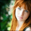 Red-haired portrait avatar, moody forest backdrop